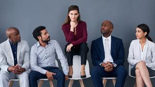 Five office workers sat on chairs