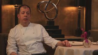 Chef Simon Radley sat at a table
