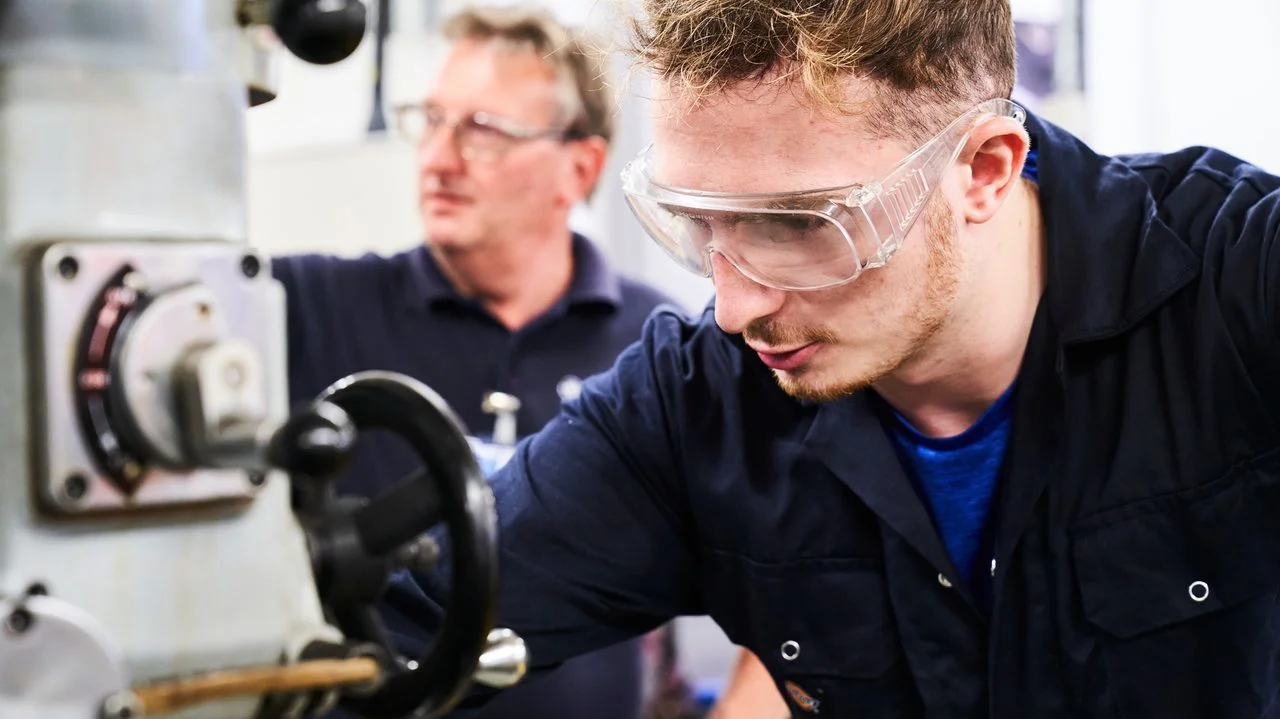 Close-up of an apprentice engineer using equipment at the Crewe facility
