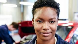 A trainee in a garage workshop