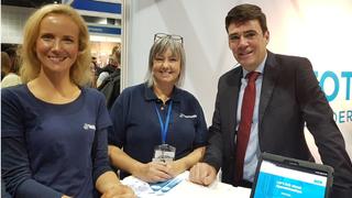 Andy Burnham with two members of the Total People team