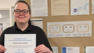 kelly ann jones holding total people certificate