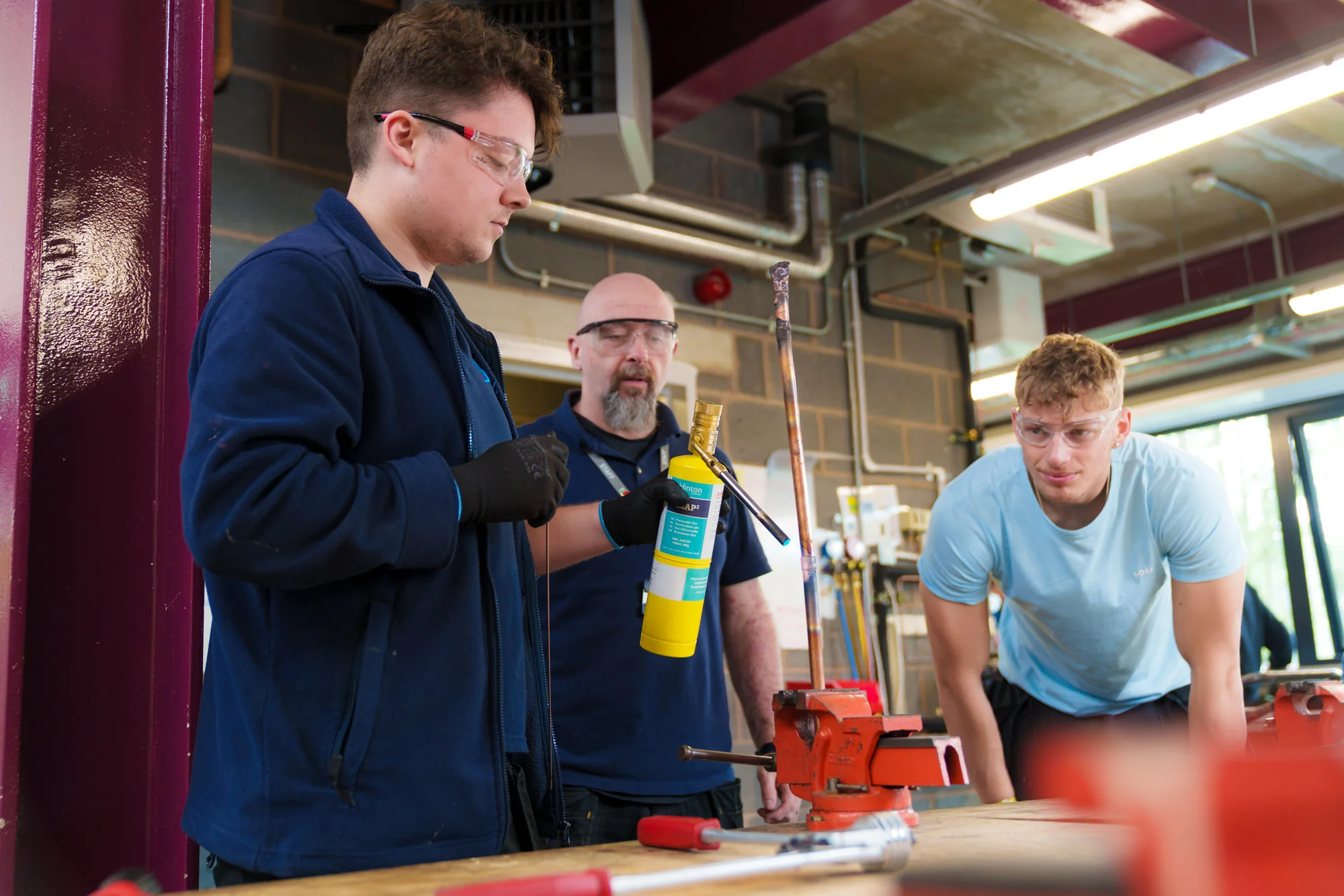 group of people with a gas cannister