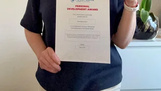 bernadette holding certificate