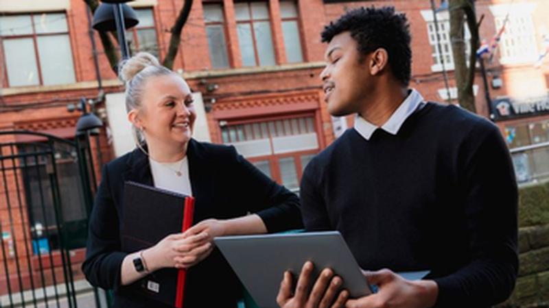 Two colleagues talking to each other