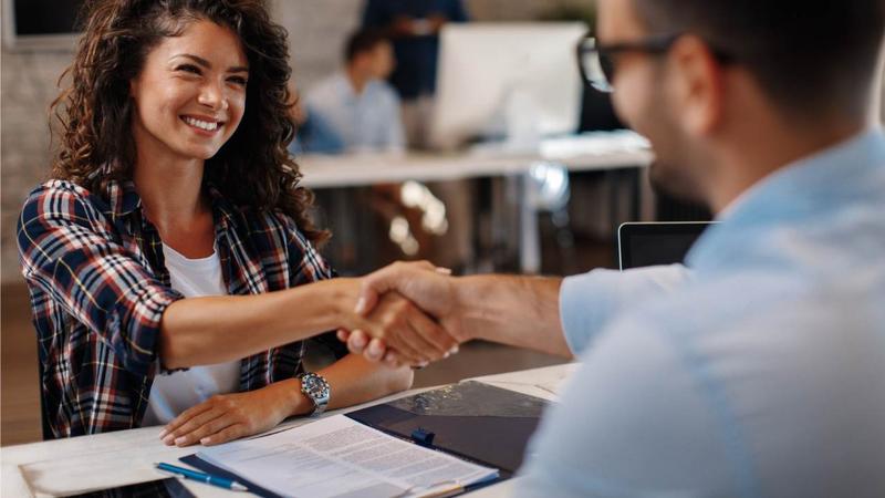 Employer shaking hands with a employee