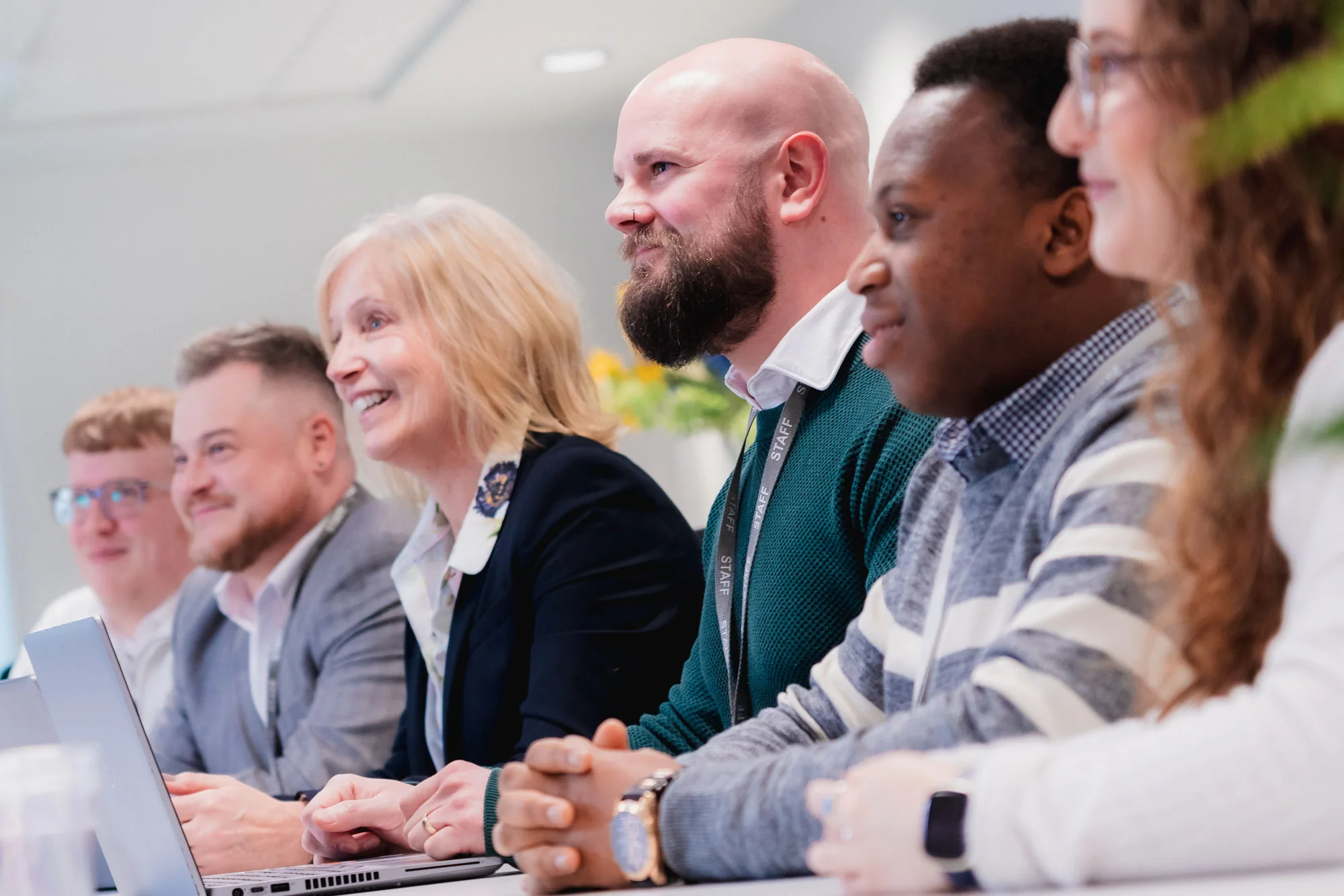 group of people sat smiling