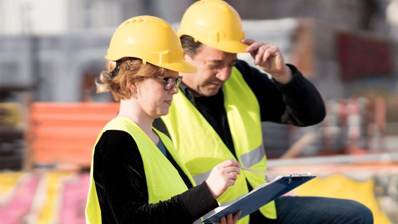Two engineers looking at plans