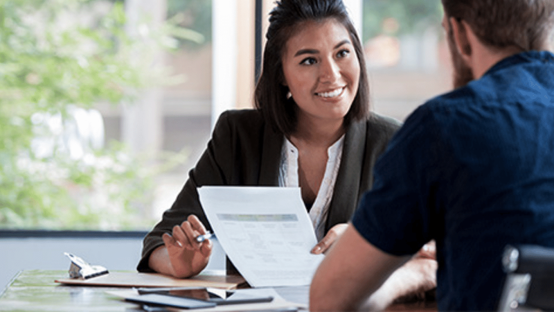 Woman talking to a man