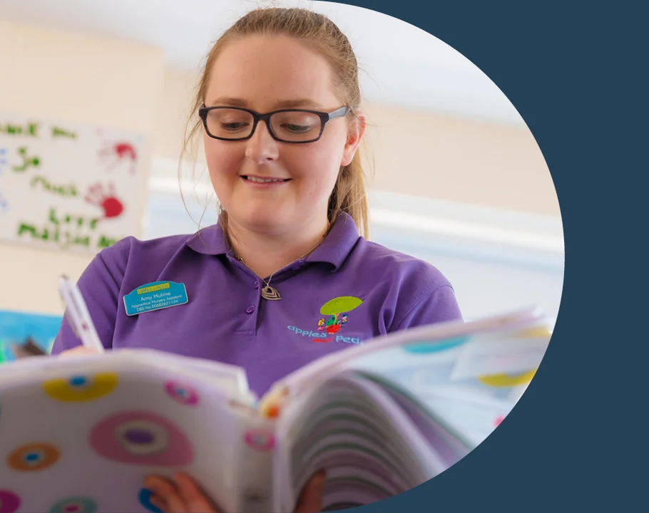 A woman looking through a book