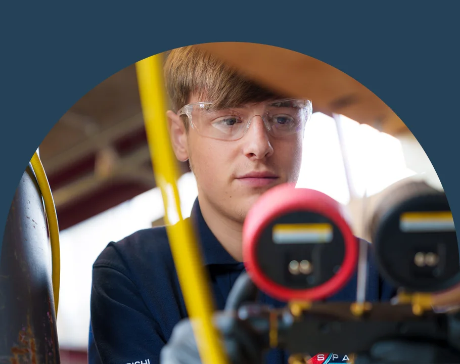 A engineer looking at meters