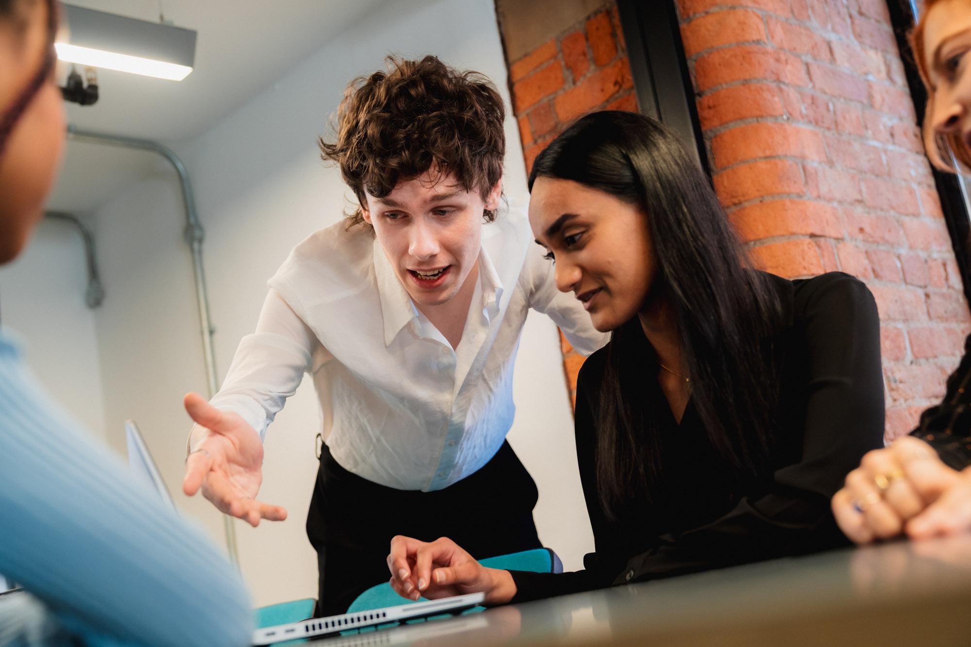 Group of people looking at a computer screen