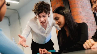 Group of people looking at a computer screen