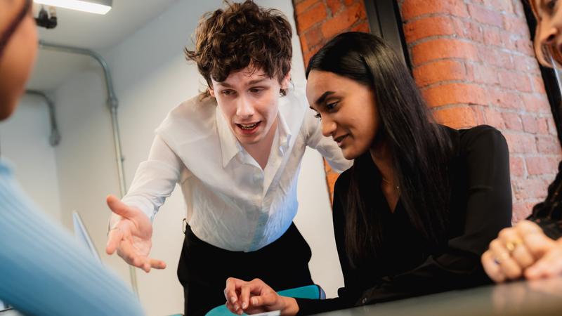 Group of people looking at a computer screen