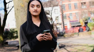Woman typing on a mobile phone
