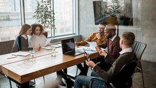 A group of colleagues having a meeting