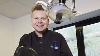 Young dentist apprentice