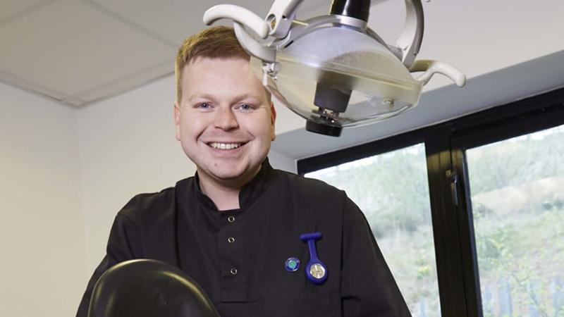 Young dentist apprentice