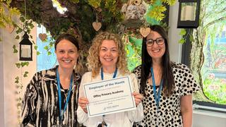 people smiling holding a certificate