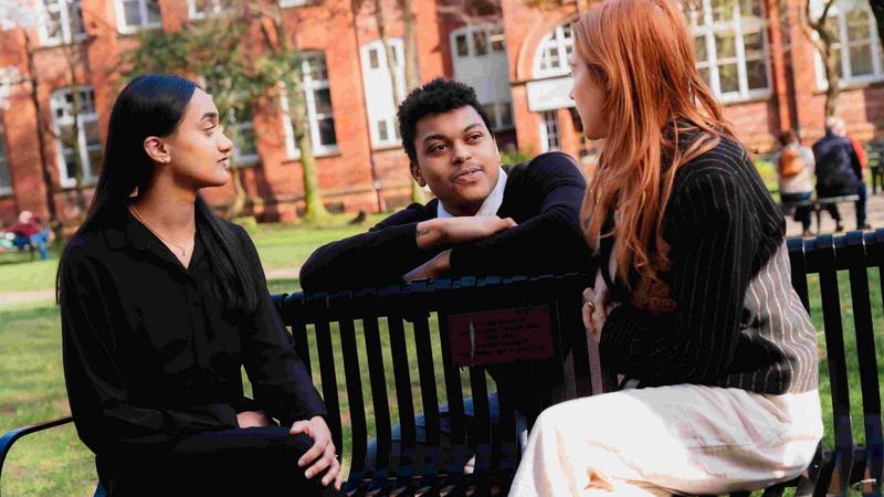 people sitting in a parl chatting