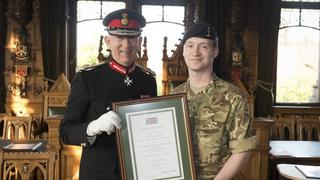 Photo of Andrew Webster receiving the award
