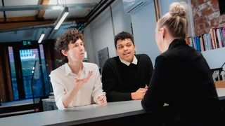 A group of colleagues having a meeting together