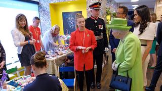 Queen Elizabeth II and the Duchess of Sussex meet learners