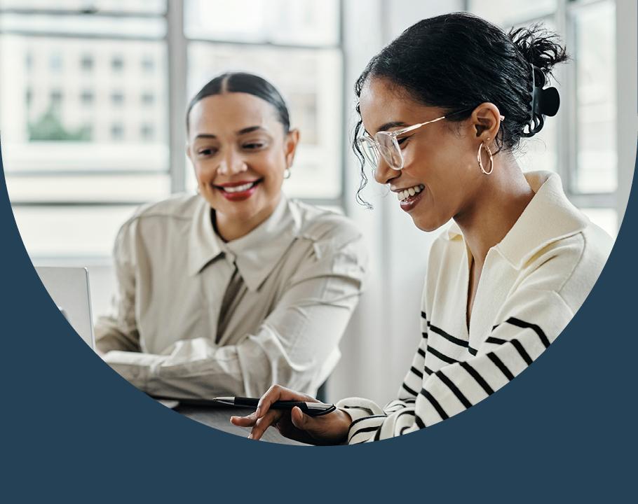 Two women going over written notes