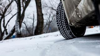 Close-up of a car driving in snow