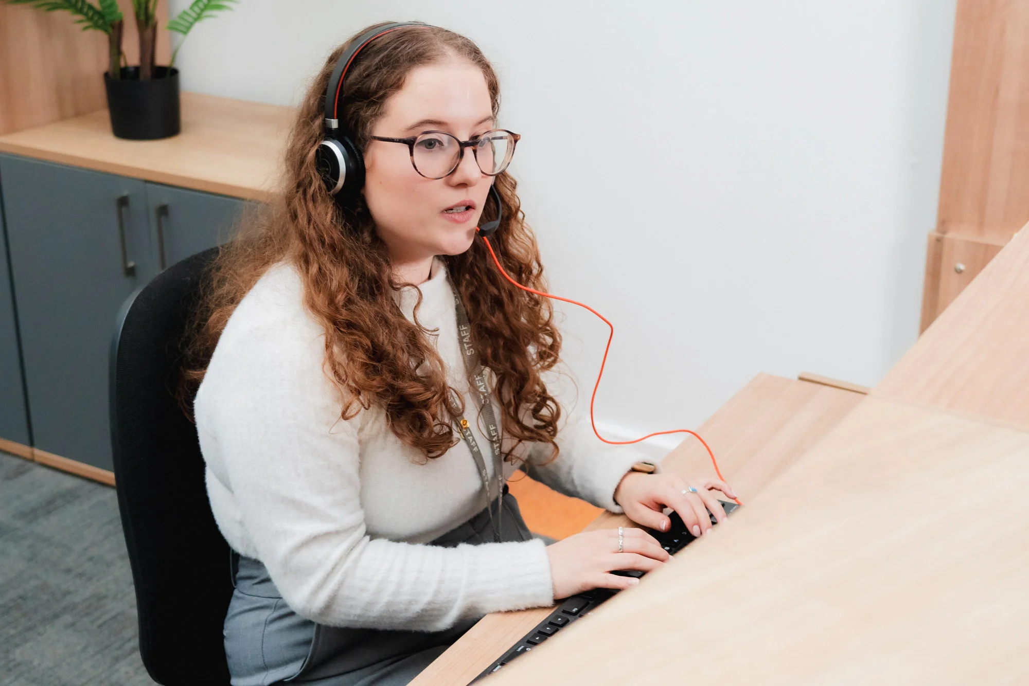 Lady with headset talking