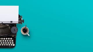 A typewriter and a cup of coffee