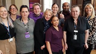 Group photo of apprentices and tutors celebrating their awards
