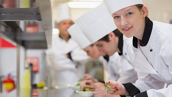 Student chefs working in a kitchen
