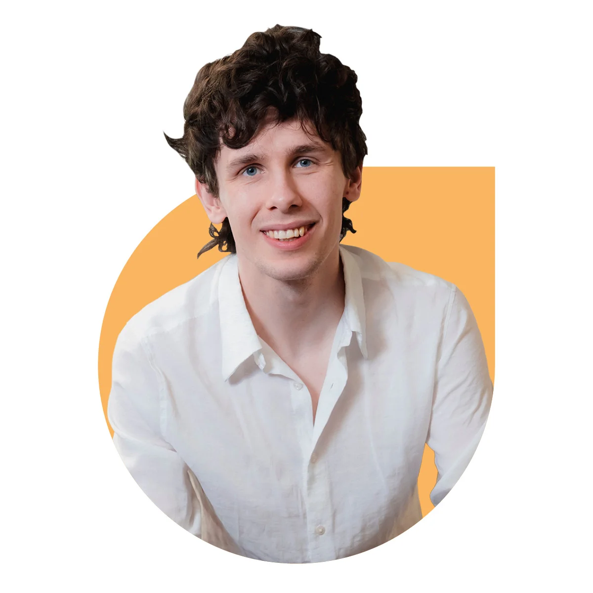 A man sat smiling in a white shirt