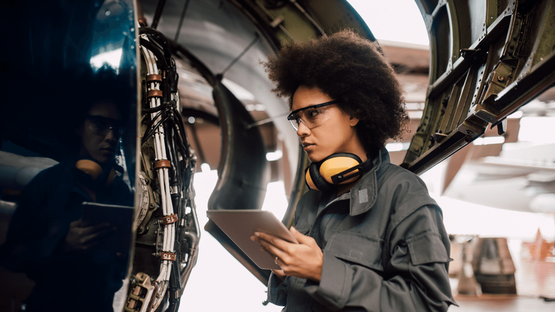 Young engineering working on a vehicle